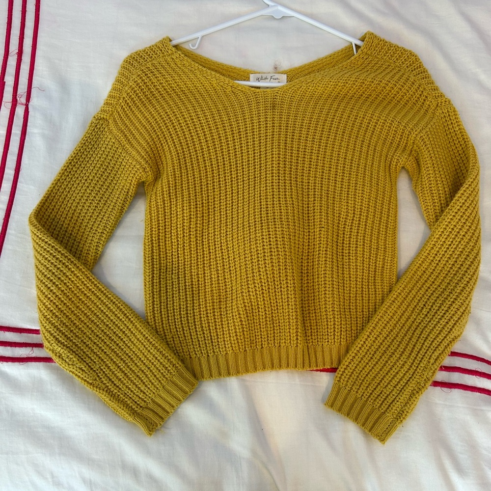 Yellow sweater with a twist in the back